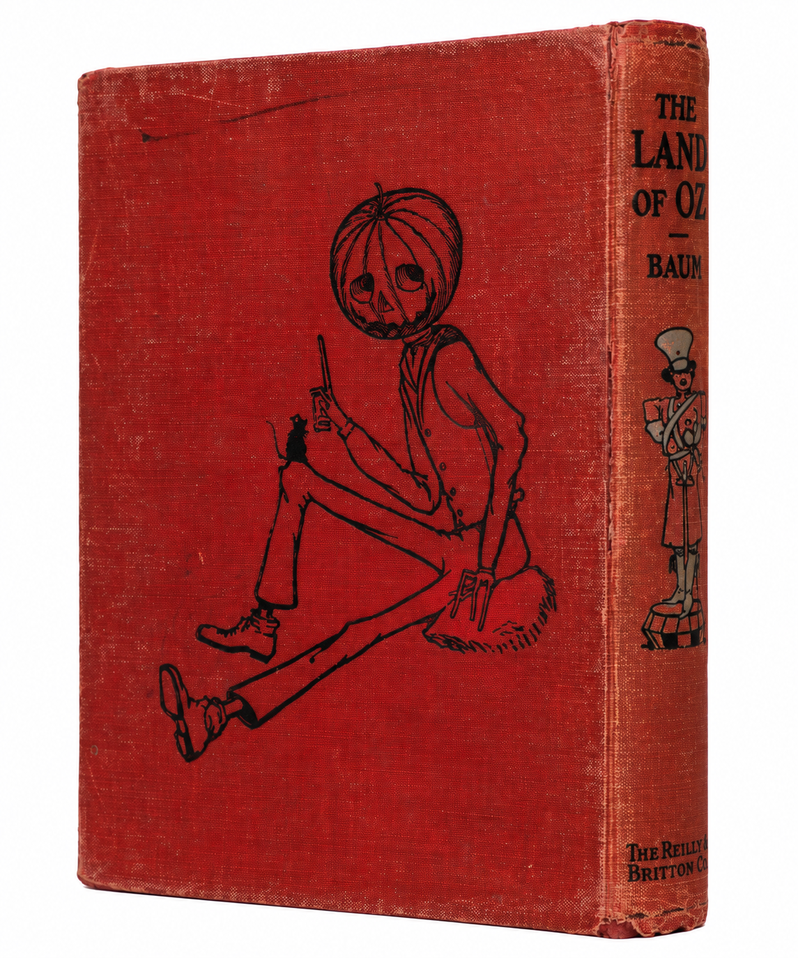 Back cover of the 1904 Land of Oz volume, showing worn red cloth and a black line illustration of Jack Pumpkinhead.